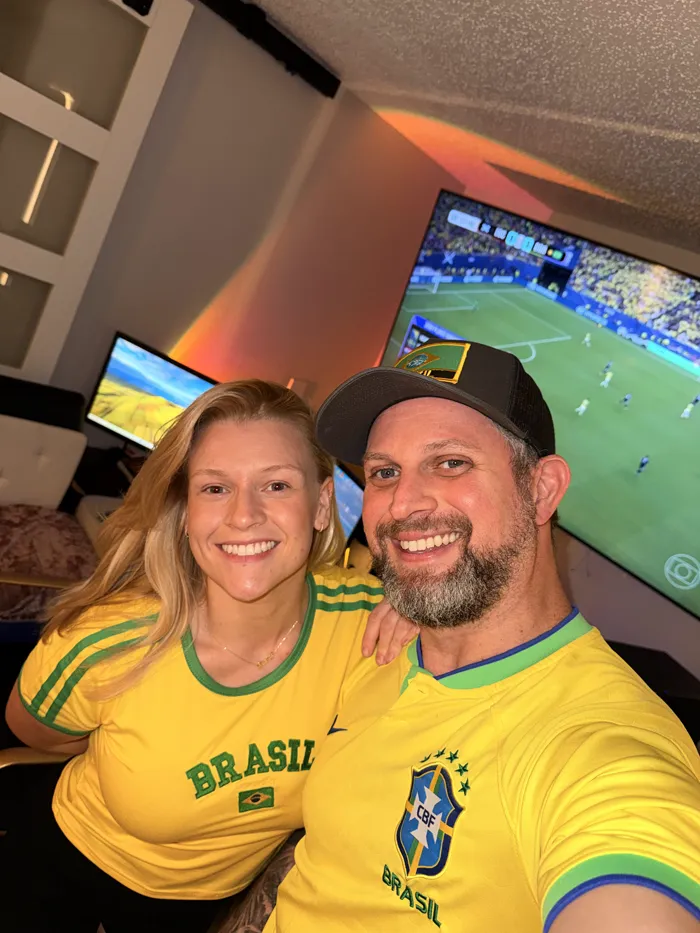 Mary and Thiago watching Brazil v Japan, World Cup 2026